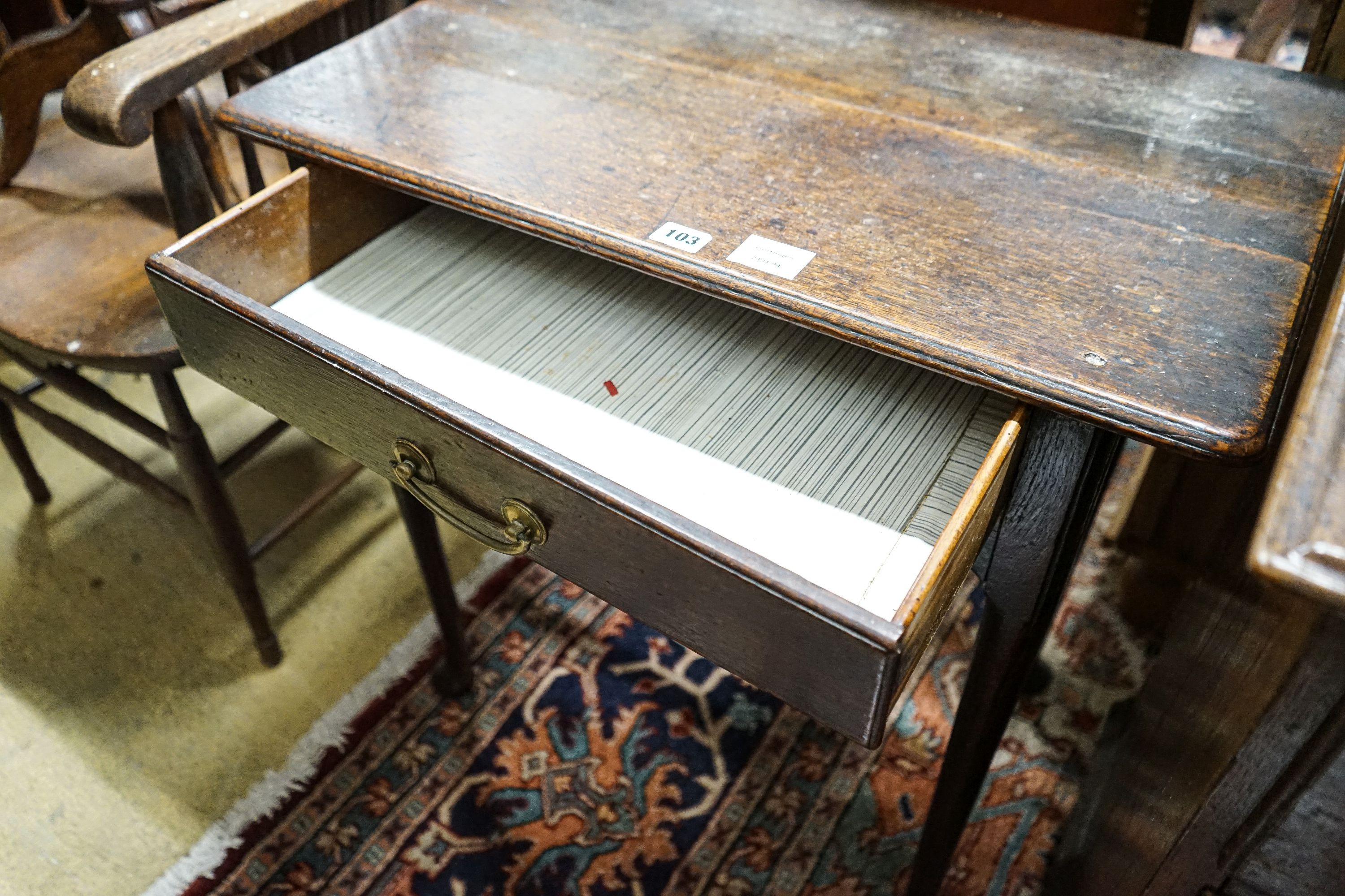 An early 18th century oak lowboy, with single drawer on slender turned legs with pad feet, width 69cm, depth 40cm, height 68cm